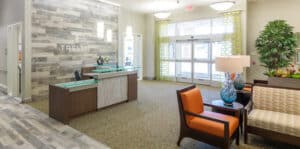 An elegant entrance and lounge area for Trellis Centennial.