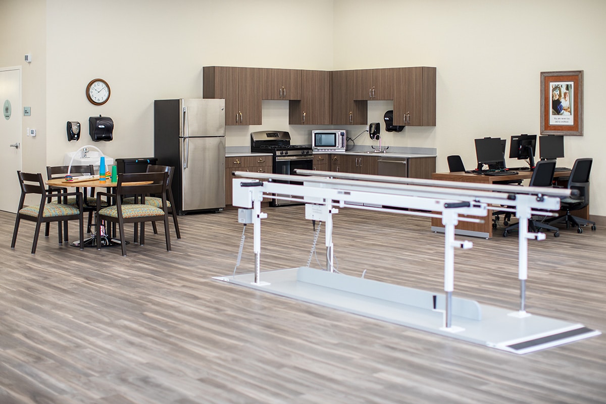 Clean and organized rehabilitation gym.